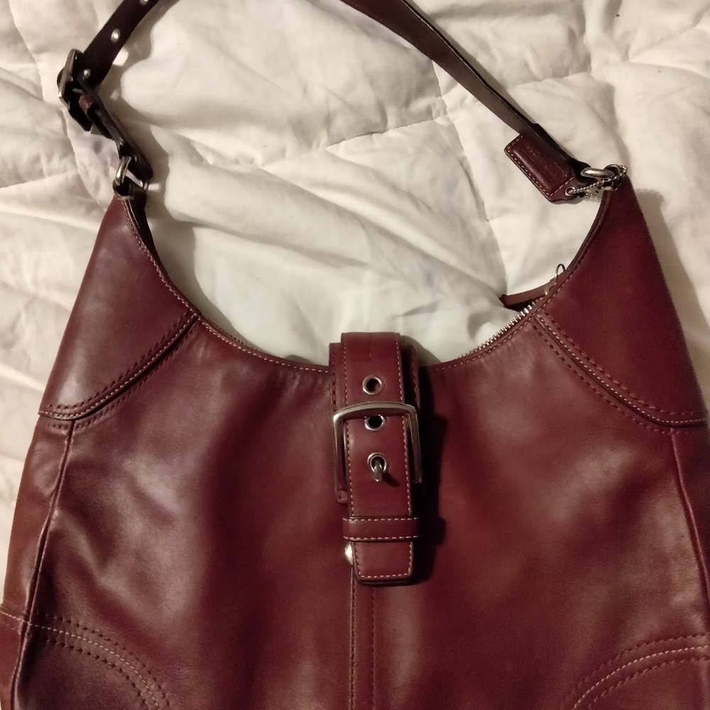 Dark mid size coach shoulder bag